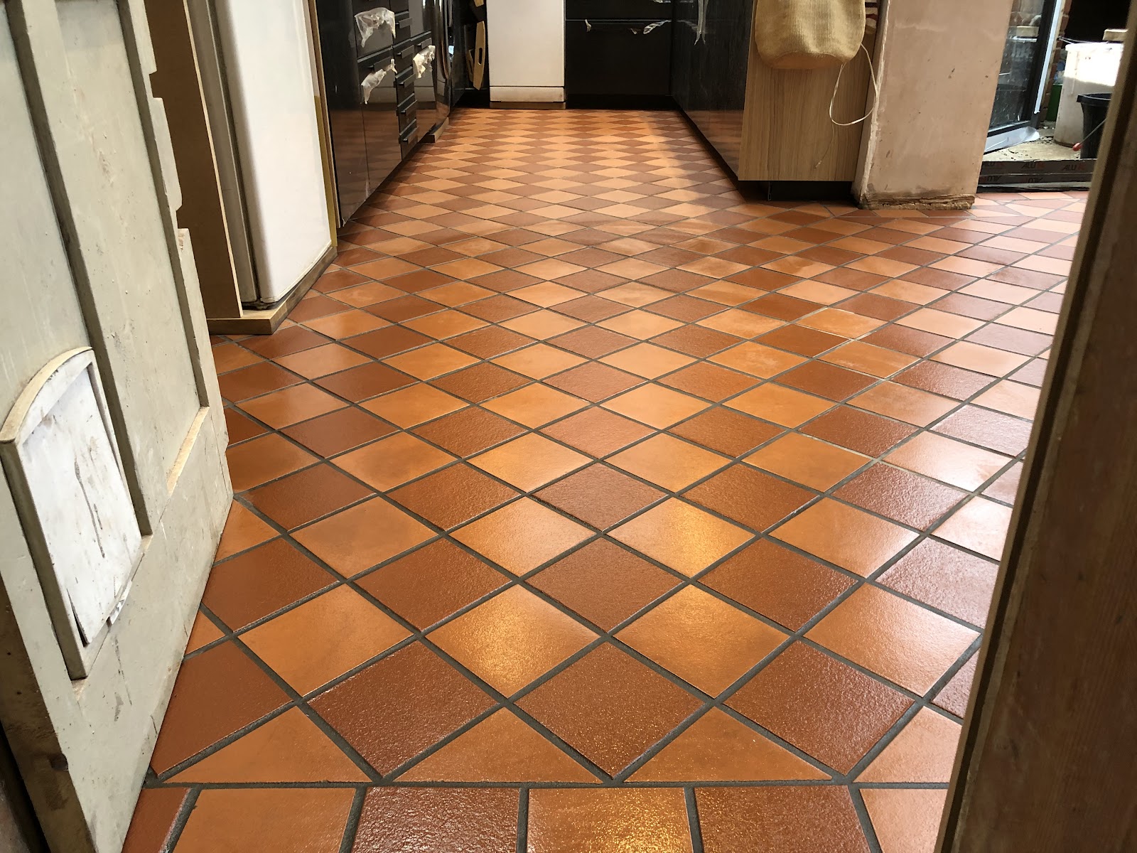 A newly laid terracotta quarry-tiled kitchen floor